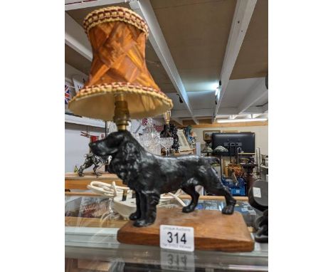 A 1930's spelter standing cocker spaniel table lamp, height to top of shade 28cm, base 15.5 x 19.5 cm.
