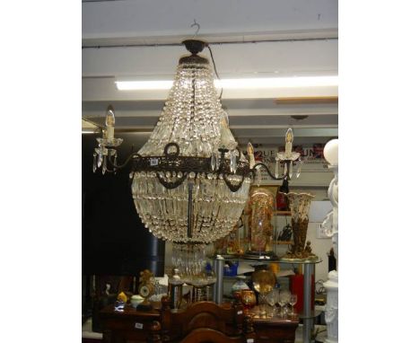 A fabulous brass 'basket' chandelier with over 4000 crystals. COLLECT ONLY.