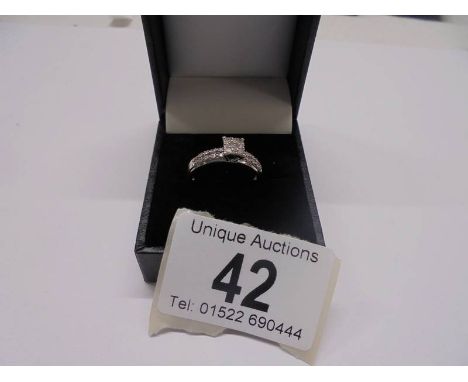 A white gold square shaped diamond ring, size N, 2.7 grams