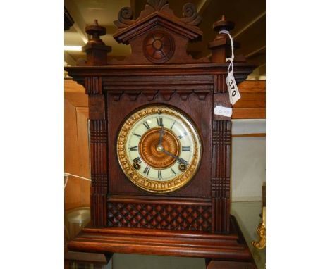 A mahogany eight day mantel clock.