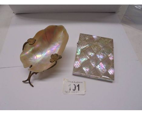 A mother of pearl engraved card case and an art deco mother of pearl caviar dish.