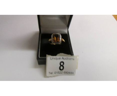 A 9ct gold ring set amber coloured stone, size S half, 3.1 grams.