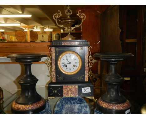 A 19th century three piece clock garniture.