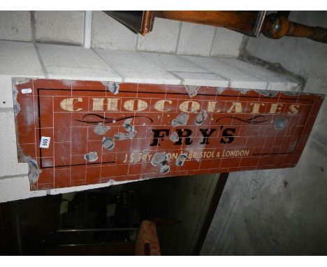 An Enamel Frys chocolate sign.Approx size is 38 x 122 cm.Bottom left hand corner 11 x 3cm cut off .Lettering wording is not e