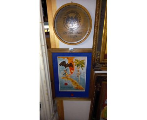 A Bacardi rum advertising barrel lid with a framed print