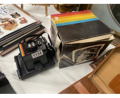 A vintage Polaroid camera in box