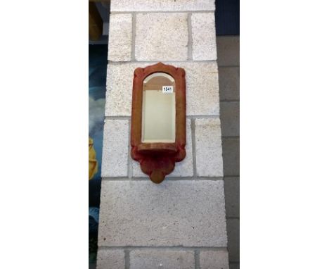 A Victorian/Edwardian velvet covered bevel mirrored back wall shelf bracket