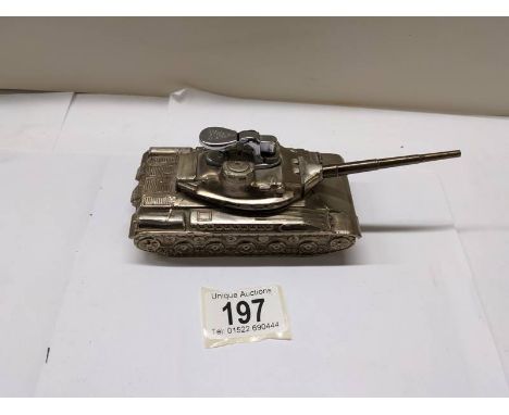 A plated table lighter in the form of a tank,