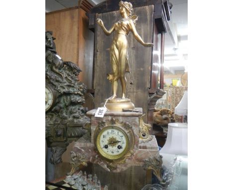 A French marble clock surmounted figure.
