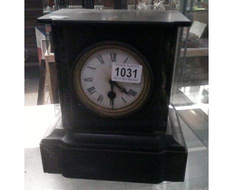 A black slate mantle clock