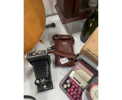 A vintage folding Kodak box brownie camera
