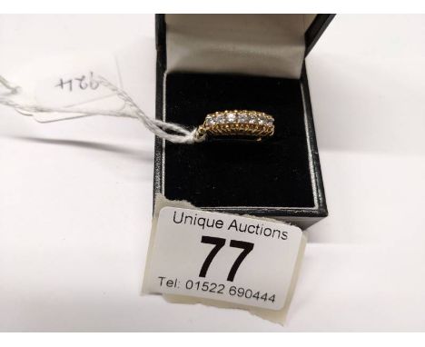 A 9ct gold seven stone ring, size Q. 2.6 grams.