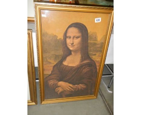A framed print on silk of the Mona Lisa. 74 x 49 cm.