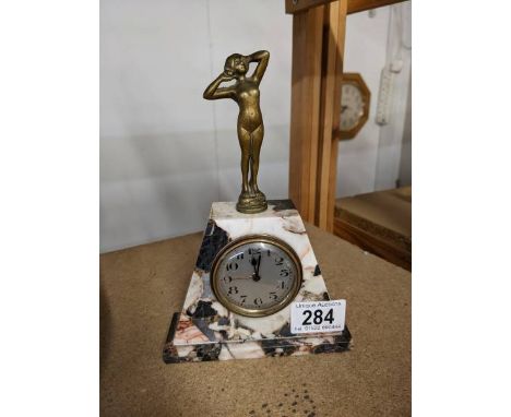 An art deco marble mantel clock surmounted figure, base 13 x 4.5 cm, height 19.5 cm.