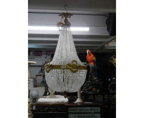 A fabulous brass 'basket' chandelier with over 4000 crystals. COLLECT ONLY.