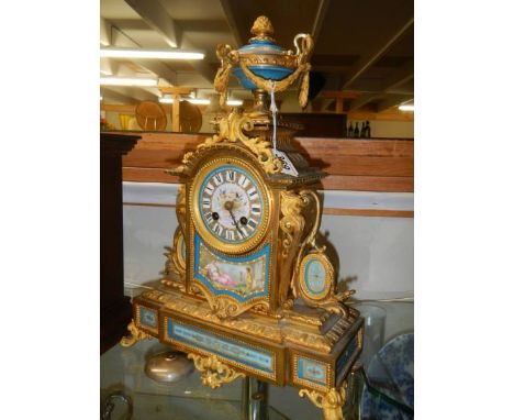 A French ormolu mantel clock with Sevres porcelain panels.Movement is a Japy Freres.Pendulum and key present.Springs ok.Clock