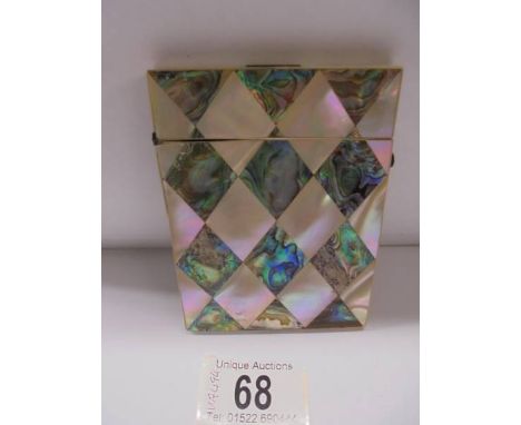 A mother of pearl and abalone card case.One Dark half diamond on lid has chips in the  corner.One White half diamond has a sm