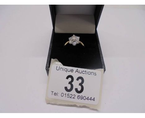 An 18ct yellow gold floral diamond ring, size M, 4.4 grams.Good condition.