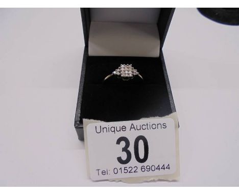 A white gold 15 stone diamond ring, size P, 1.6 grams.