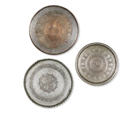 Trois plateaux en cuivre étamé, Perse XIX-XXe siècle Three large tinned-copper chargers, Persia, 19th/20th Centuryeach of cir