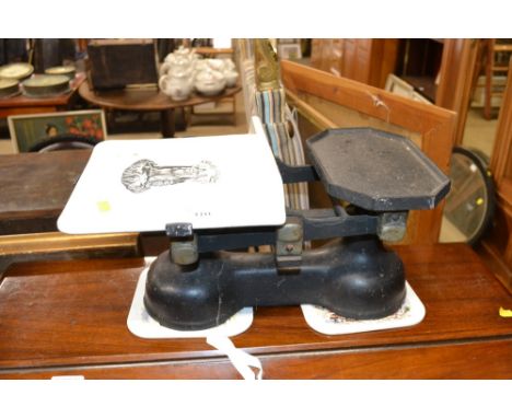 A set of scales with porcelain tray 