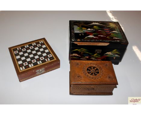 An oriental decorated trinket box and a travel chess set etc. 