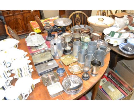 A quantity of various silver plated and metal ware to include tankards, cigarettes boxes, ash trays, trophies, set of scales 