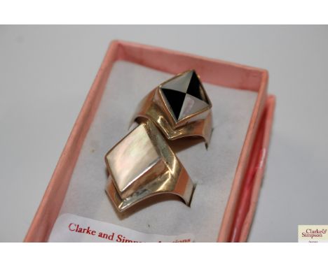Two Sterling silver and mother of pearl set rings, one size W the other W/X, total weight approx. 19gms 