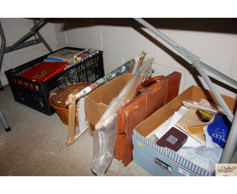 A large quantity of various sewing related items to include wicker sewing basket, tapestry frame, various cottons, etc.