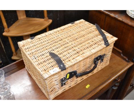 A wicker picnic hamper and contents of various sewing items 