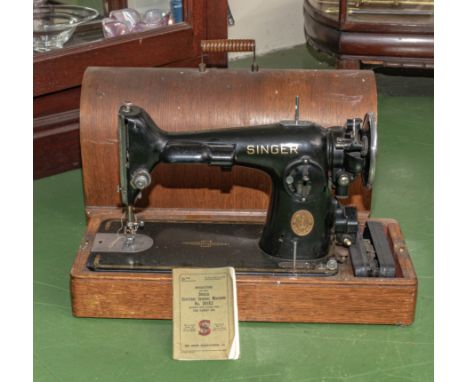 Table top Singer sewing machine with electric pedal