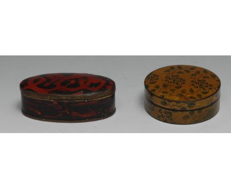 A 19th century vernis martin papier mache circular snuff box, decorated overall with leafy stems on a gilt ground, 9cm diam, 