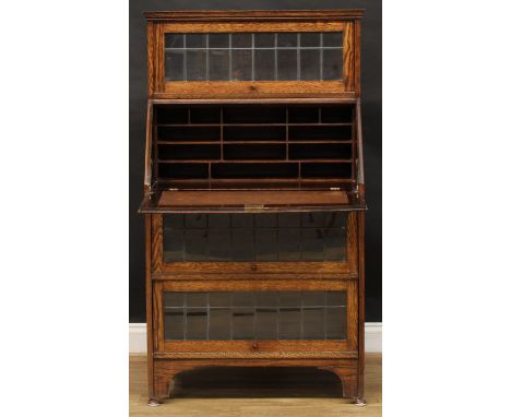 An early 20th century oak Globe Wernicke type lead glazed bureau bookcase, 139.5cm high, 80cm wide, 44cm deep 