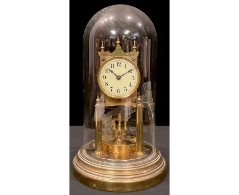 A German brass anniversary clock, Gustav Becker, Freiburg, torsion pendulum, the mechanism numbered 2249776, glass dome, 32cm