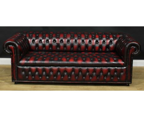 A contemporary Chesterfield sofa, stuffed-over deep-button upholstery, 67cm high, 195cm wide, the seat 142cm wide and 54cm de