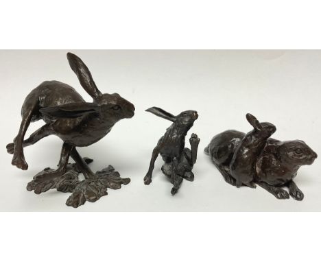 Richard Cooper foundary cast bronze of a Hare scratching, 6cm high; Hare running, 10.5cm; another, 6cm high (3) 