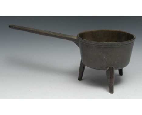 An 18th century bronze tripod skillet, 46cm long, c.1760 