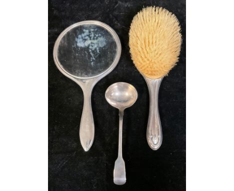 A William IV silver sauce ladle, London 1832, 50g; a George V silver hand mirror, engine turned, Birmingham 1931; a George V 