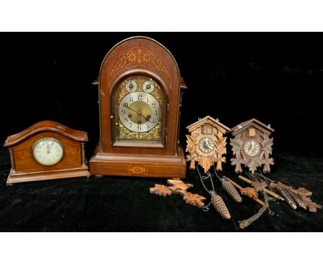 A mahogany arched top bracket clock, Junghans movement, arched brass dial, silvered chapter ring, Arabic numerals, three wind