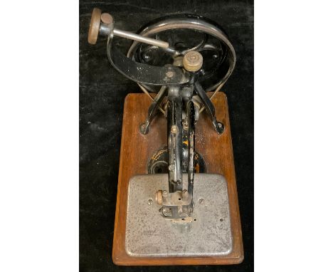 A Willcox &amp; Gibbs SM. Co. manual sewing machine, mahogany rectangular base, moulded edge, 32cm wide 