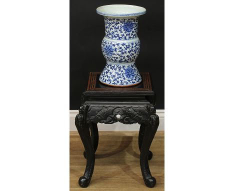 A Chinese lacquer jardiniere stand, square top with incised meandrous border, shaped apron, cabriole legs carved to the knees