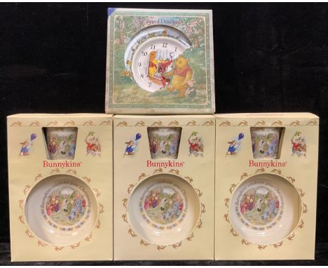 A Royal Doulton Bunnykins nursery ware mug and bowl set, "Celebrate Your Christening", boxed; two others the same; a Royal Do