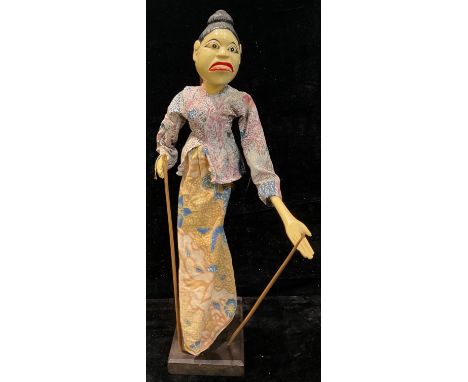 An Indonesian Wayang Golek puppet, on stand, 55cm high overall 