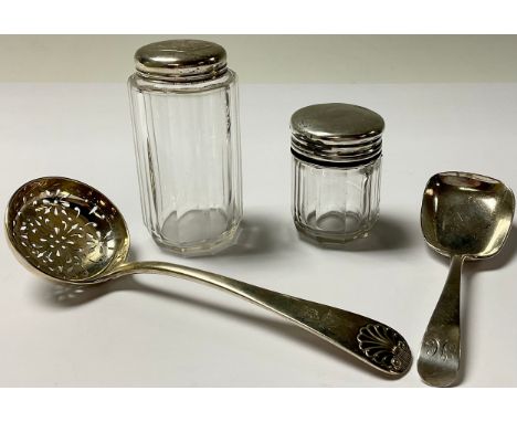 A George III silver caddy spoon, London 1806, 25g; a Victorian silver sugar spoon, London 1894, 52g; a Victorian clear glass 