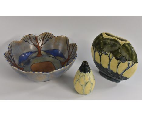 A Burleigh Ware 'Tree Pattern' bowl with wavy rim, factory mark to foot, signed by R. Bennett, 26cm diameter; two vases by Ja