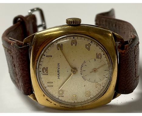 A gentleman's 9ct gold Marvin watch, Arabic numerals, subsidiary seconds dial, brown leather strap, the Dennison case marked 