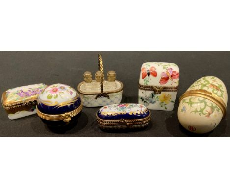 An enamel egg shaped bonbonnière, 6.5cm; a Limoges porcelain spherical pot and cover, basket of three scent/salts bottles, sn