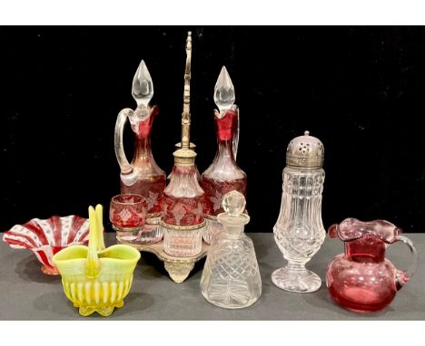 A late 19th century quatrefoil silver plated four bottle cruet stand, complete with pair of oil and vinegar bottles with stop