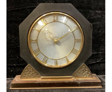 An Art Deco brass mounted octagonal mantel clock, 20cm high 
