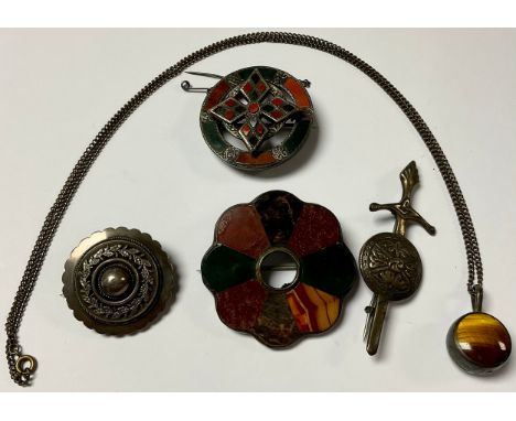 A 19th century silver mounted Scottish hardstone brooch, registration lozenge, 4cm diameter; another similar Scottish specime